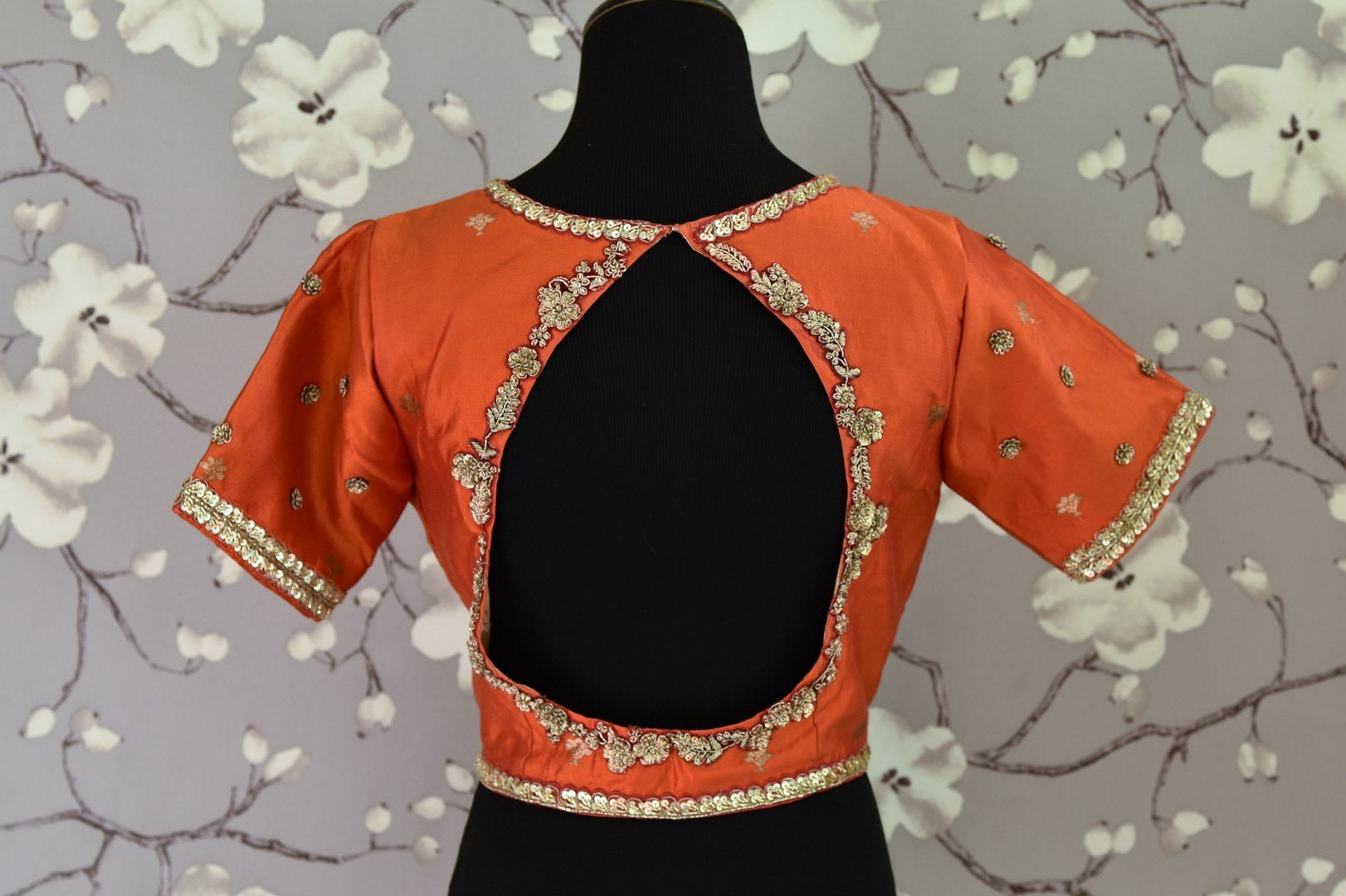 Shop rust orange embroidered Banarasi saree blouse online in USA. Score a perfect ten for your saree look with exquisite designer saree blouses from Pure Elegance Indian fashion store in USA. Shop now.-back