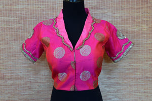 Shop bright pink embroidered Banarasi saree blouse online in USA. Elevate your ethnic saree style with a tasteful collection of designer saree blouses from Pure Elegance Indian clothing store in USA.-front