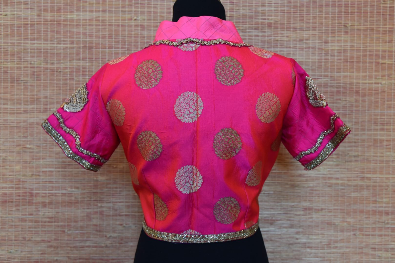 Shop bright pink embroidered Banarasi saree blouse online in USA. Elevate your ethnic saree style with a tasteful collection of designer saree blouses from Pure Elegance Indian clothing store in USA.-back