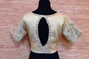 Shop gorgeous cream raw silk embroidered designer saree blouse online in USA. Stand amongst the crowd with your tasteful ethnic style by pairing your elegant sarees with designer saree blouses from Pure Elegance Indian fashion store for women in USA.-back