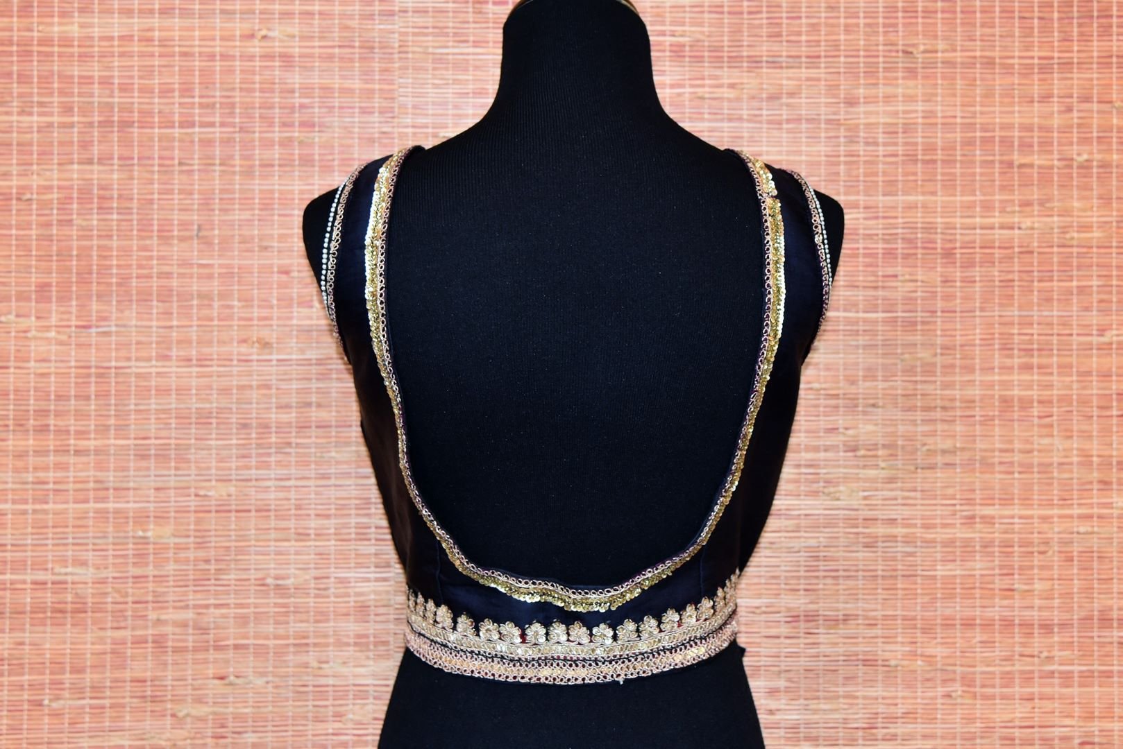 Buy navy blue embroidered deep back sleeveless saree blouse online in USA. Stand amongst the crowd with your tasteful ethnic style by pairing your elegant sarees with designer saree blouses from Pure Elegance Indian fashion store for women in USA.-back