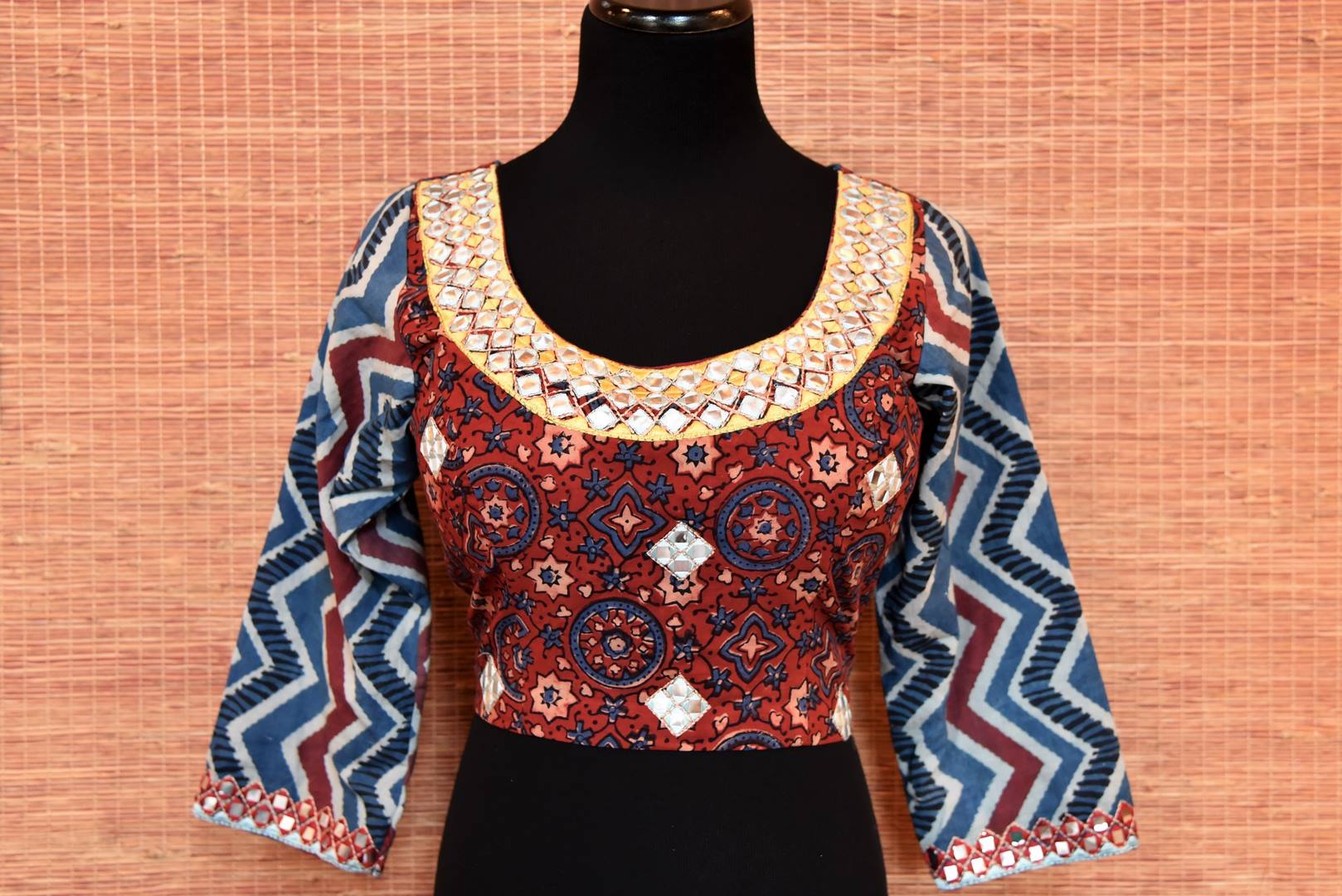 Shop red and blue block print sari blouse online in USA with mirror work. Go for a striking ethnic sari style with beautiful Indian sari blouses from Pure Elegance Indian fashion store in USA.-front