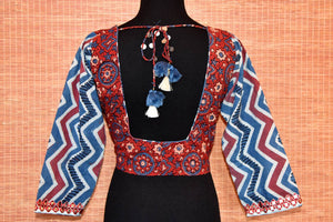 Shop red and blue block print sari blouse online in USA with mirror work. Go for a striking ethnic sari style with beautiful Indian sari blouses from Pure Elegance Indian fashion store in USA.-back