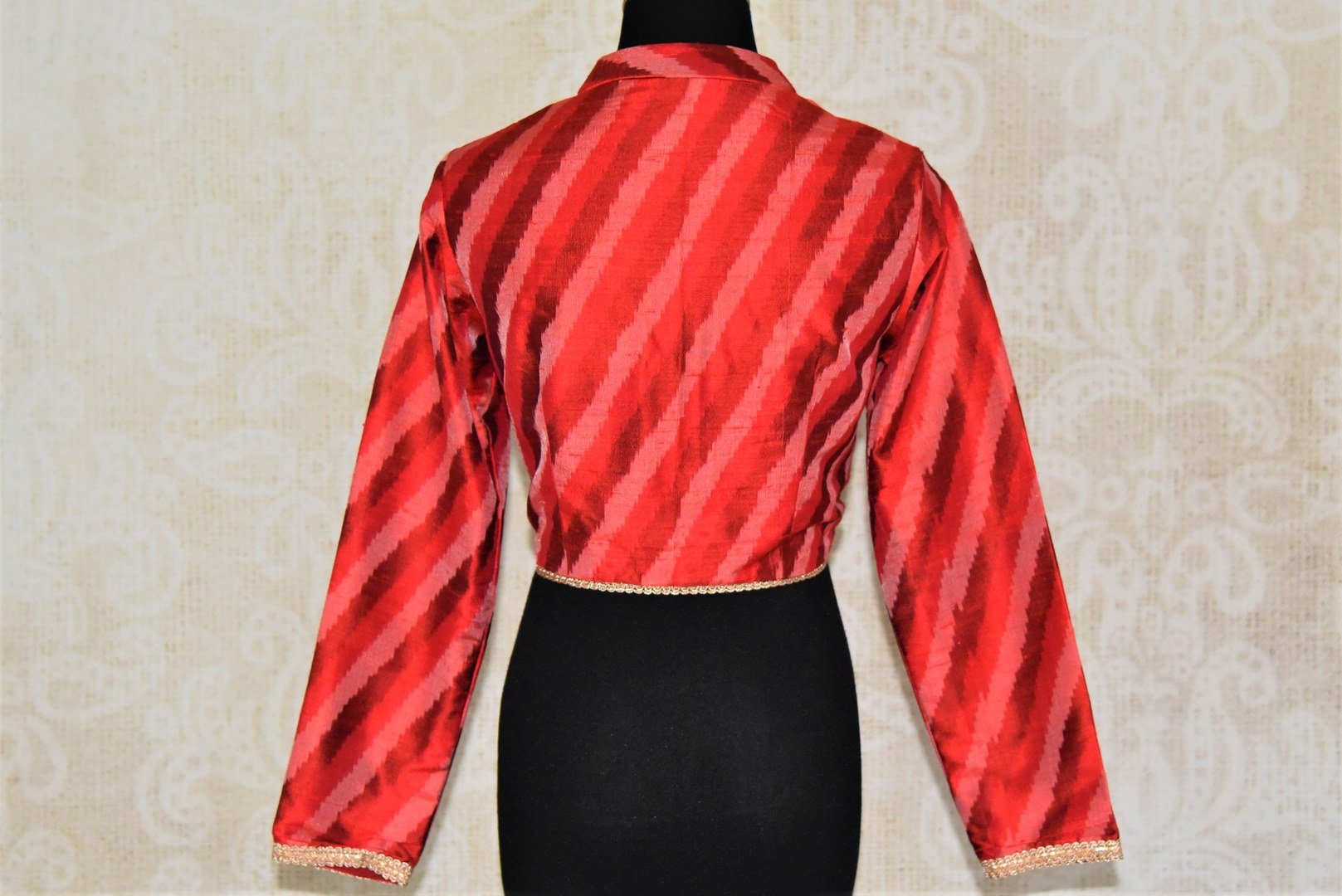 Shop bright red ikkat silk readymade saree blouse online in USA with full sleeves. Enhance your traditional sarees at weddings and festive occasions with designer saree blouses from Pure Elegance Indian clothing store in USA.-back