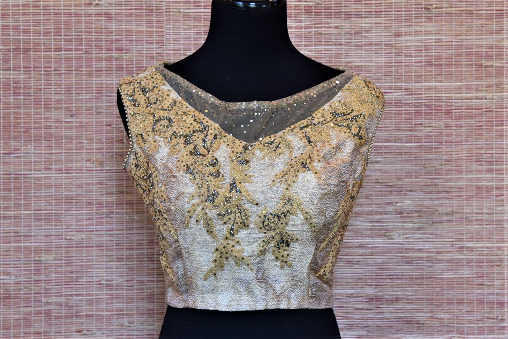 Shop beige embroidered net sleeveless saree blouse online in USA. Highlight your beautiful sarees with gorgeous designer sarees blouses, readymade saree blouses from Pure Elegance Indian clothing store in USA.-front