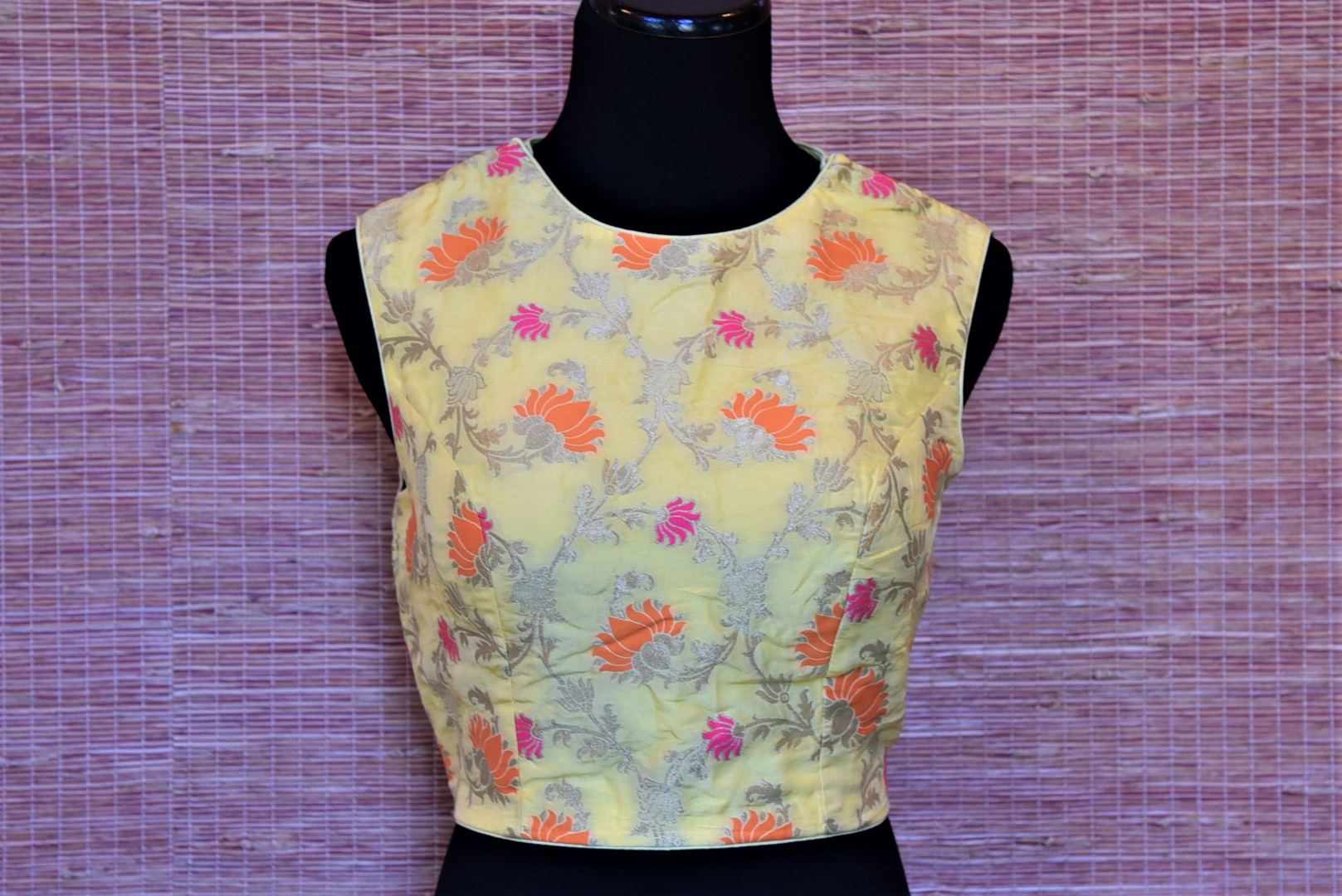 Shop lemon yellow Banarasi silk sleeveless saree blouse online in USA. Highlight your beautiful sarees with gorgeous designer sari blouses, readymade saree blouses from Pure Elegance Indian clothing store in USA.-front