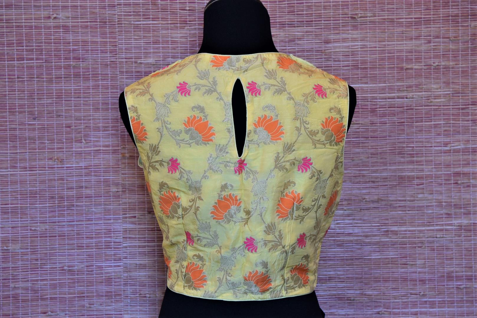 Shop lemon yellow Banarasi silk sleeveless saree blouse online in USA. Highlight your beautiful sarees with gorgeous designer sari blouses, readymade saree blouses from Pure Elegance Indian clothing store in USA.-back