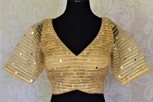 Shop stunning golden net sari blouse online in USA with mirror work. Elevate your handwoven sarees with this beautiful readymade saree blouses from Pure Elegance Indian clothing store in USA.-front