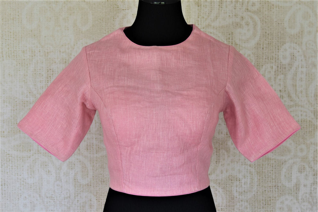 Shop stunning solid pink linen saree blouse online in USA. Complete your ethnic saree look with designer blouses, readymade sari blouse, embroidered saree blouse from Pure Elegance Indian saree store in USA.-front