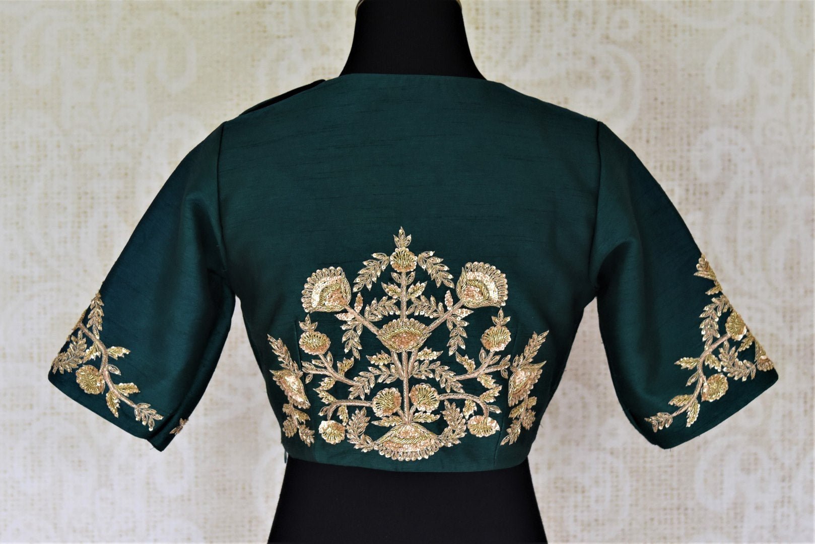 Shop stunning dark green hand embroidered silk saree blouse online in USA. Complete your beautiful Indian saris with designer saree blouses ,readymade saree blouse, cotton blouses, silk sari blouses from Pure Elegance Indian saree store in USA.-back