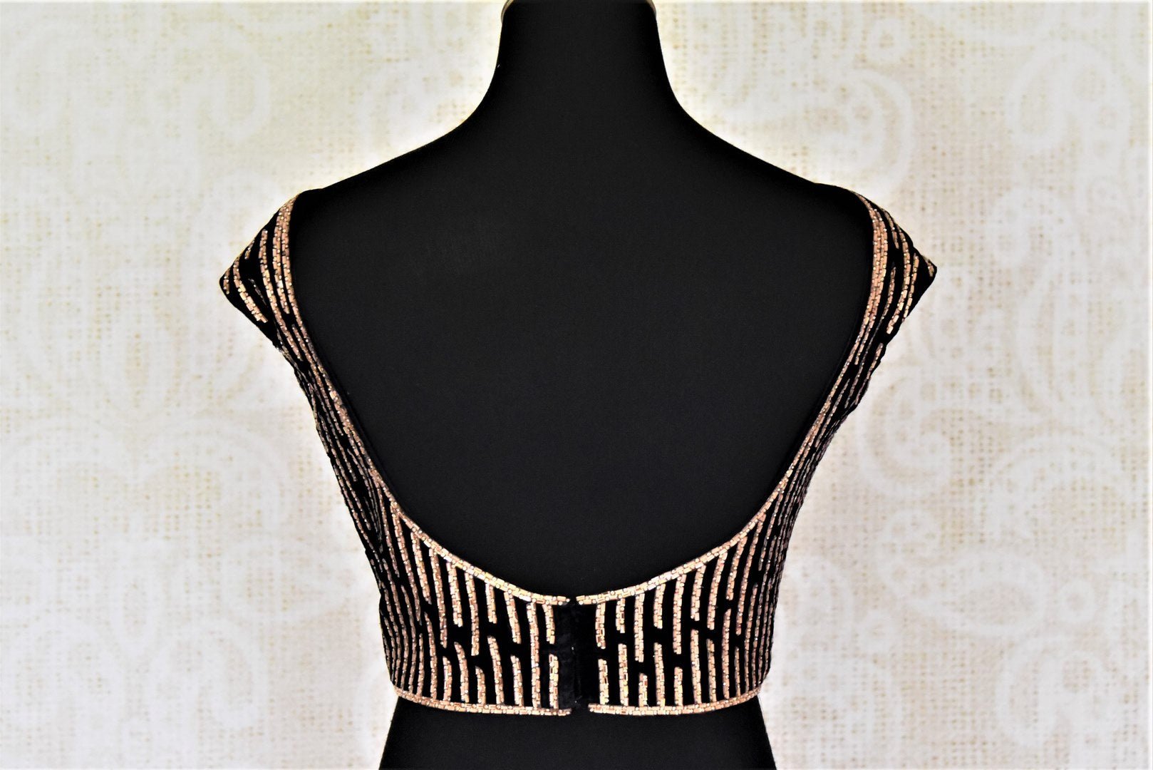Shop black boat neck stone work velvet sari blouse online in USA with deep-U back. Complete your ethnic saree look with designer blouses, readymade sari blouse, embroidered saree blouse from Pure Elegance Indian saree store in USA.-back