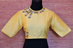 Shop lovely lemon yellow embroidered Banarasi saree blouse online in USA with cutout back. Complete your Indian sarees with exquisite readymade saree blouse from Pure Elegance Indian clothing store in USA.-front