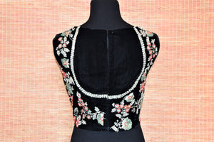 Shop ravishing black sleeveless embroidered velvet saree blouse online in USA. Complete your Indian sarees with exquisite readymade sari blouse from Pure Elegance Indian clothing store in USA.-back