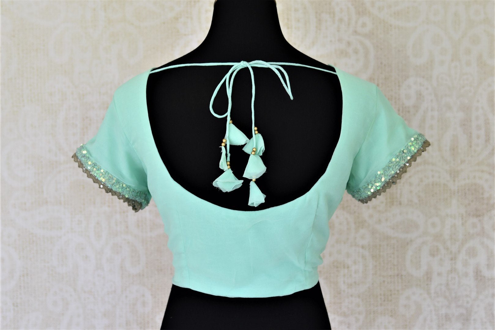 Buy gorgeous mint green georgette sari blouse online in USA with embroidered sleeves. Complete your ethnic saree look with designer blouses, readymade sari blouse, embroidered saree blouse from Pure Elegance Indian saree store in USA.-back