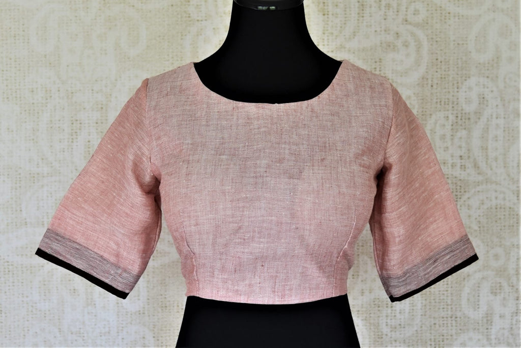 Buy elegant solid dusty pink linen sari blouse online in USA. Complete your ethnic saree look with designer blouses, readymade sari blouse, embroidered saree blouse from Pure Elegance Indian saree store in USA.-front