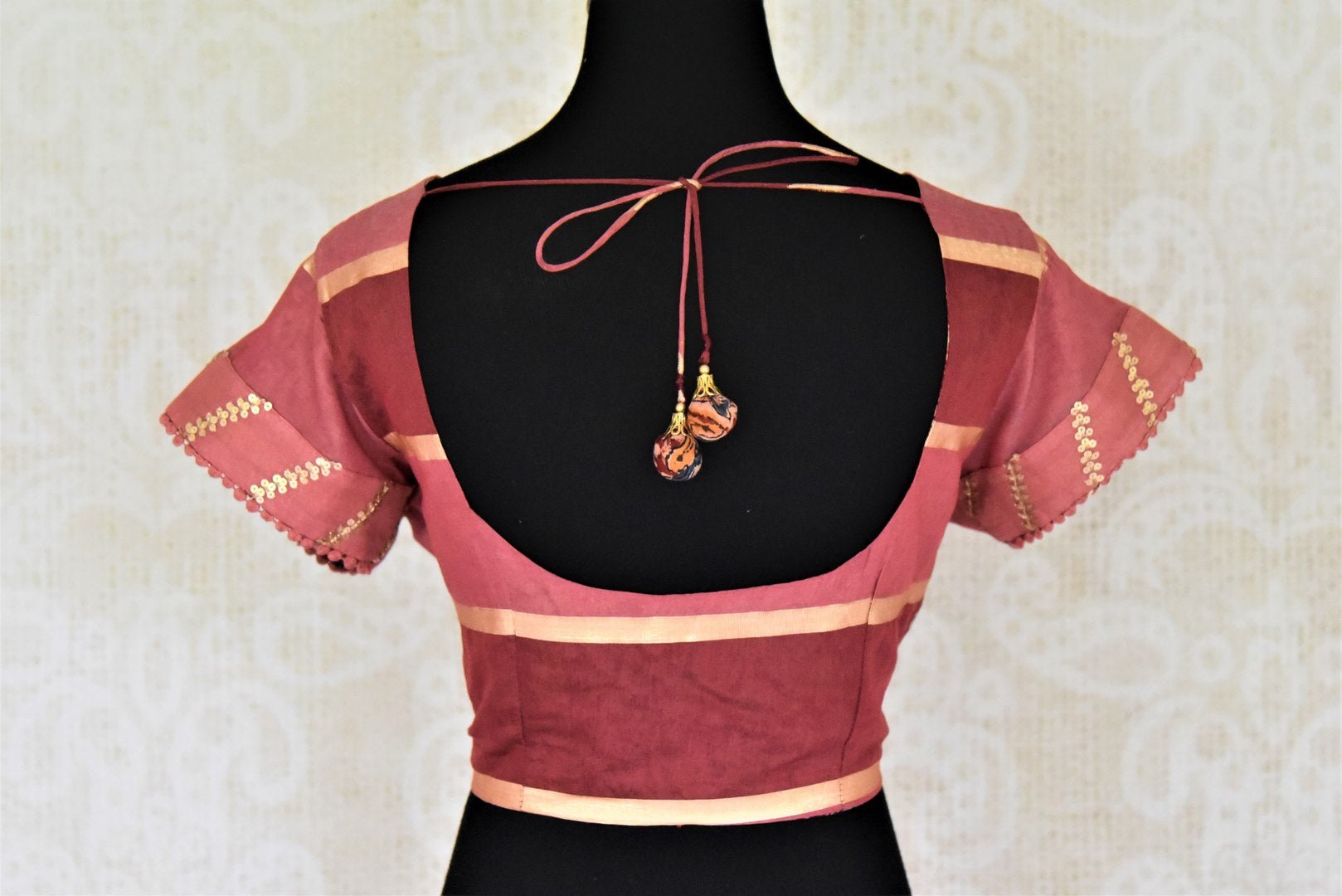 Shop pink and red striped embroidered silk sari blouse online in USA. Complete your ethnic saree look with designer blouses, readymade sari blouse, embroidered saree blouse from Pure Elegance Indian saree store in USA.-back