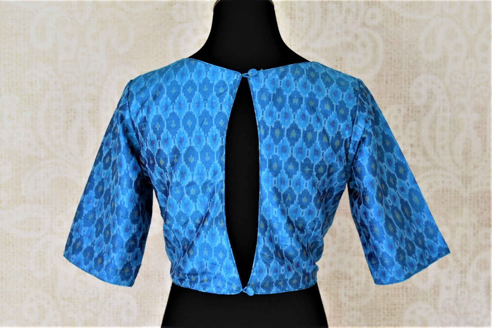Shop stunning blue ikkat silk saree blouse online in USA with key-hole back. Shop beautiful designer sari blouses, readymade saree blouse in USA from Pure Elegance Indian fashion store in USA. Shop online now.-back