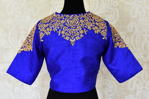 Shop gorgeous bright blue embroidered silk saree blouse online in USA. Complete your ethnic sarees with stunning designer saree blouse, readymade sari blouse, embroidered saree blouse in USA from Pure Elegance Indian fashion store in USA.-back