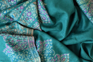Shop stunning sea green stole with multicolor Kani weave online in USA. Shop beautiful designer stoles, embroidered dupattas, Banarasi dupattas, handwoven dupatta from Pure Elegance Indian fashion store in USA.-closeup