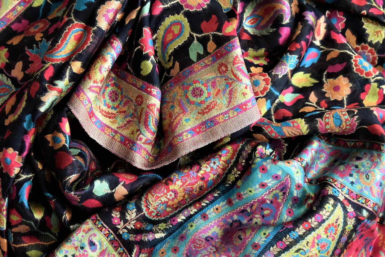 Buy stunning black Kani weave stole online in USA with multicolor border. Shop beautiful stunning Indian dresses, designer clothing, designer Anarkali suits, embroidered sarees from Pure Elegance Indian fashion store in USA.-flatlay