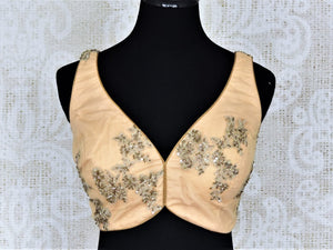 Buy stunning cream embroidered net sleeveless saree blouse online in USA. Add an elegant touch to your ethnic sarees with beautiful designer blouses, readymade saree blouses, Banarasi blouses, choli-cut blouses from Pure Elegance Indian fashion store in USA.-full view
