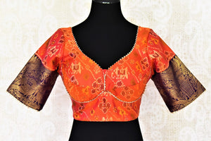 Shop beautiful orange ikkat saree blouse online in USA with purple zari sleeves. Go for a perfect saree style with latest designer saree blouses, pure silk blouse, choli-cut saree blouses, readymade sarees blouse, padded saree blouses from Pure Elegance Indian saree store in USA.-full view