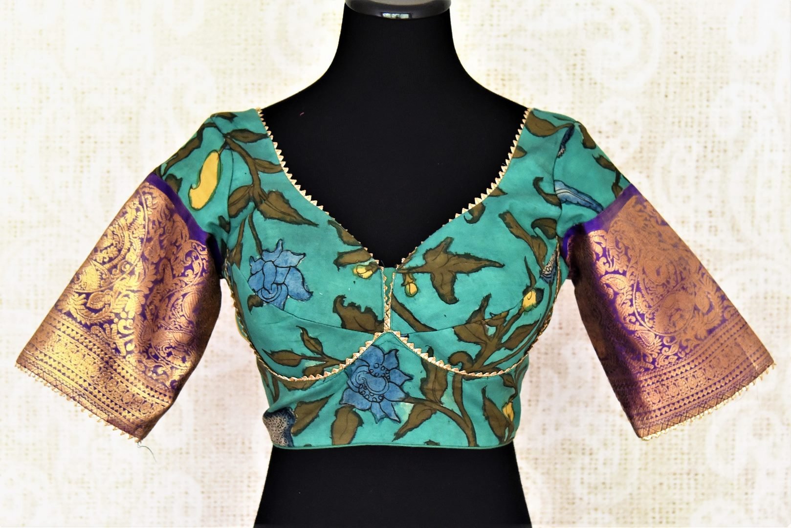 Buy beautiful sea green Kalamkari silk saree blouse online in USA with Banarasi sleeves. Go for a perfect saree style with latest designer saree blouses, pure silk blouse, choli-cut saree blouses, readymade sarees blouse, padded saree blouses from Pure Elegance Indian saree store in USA.-full view