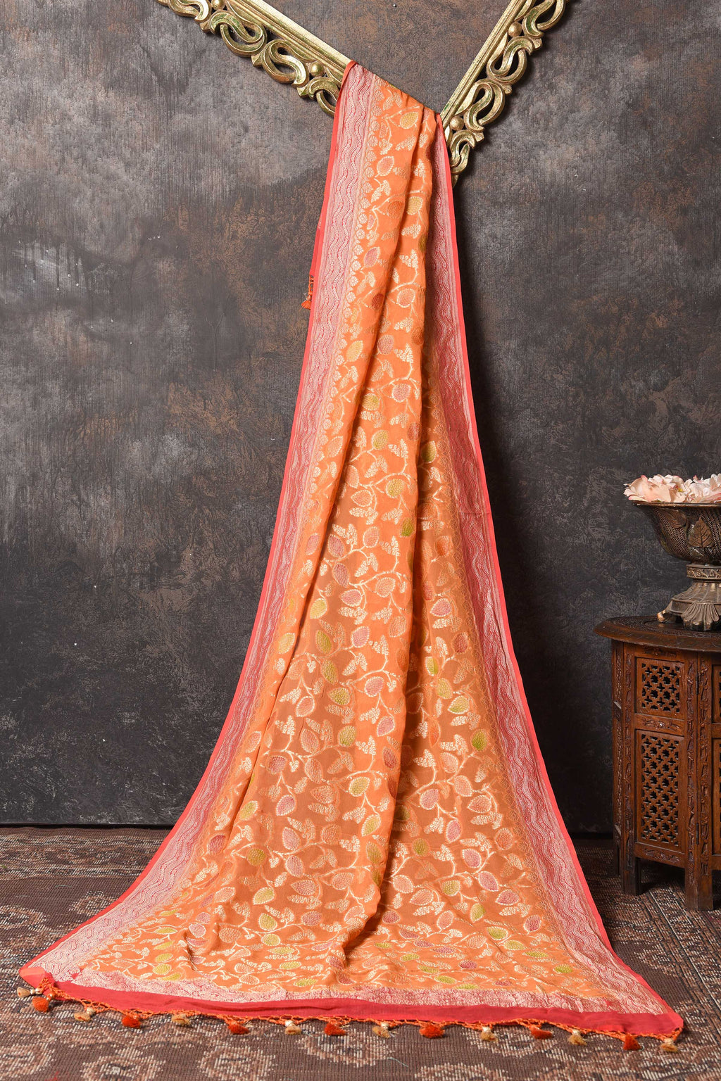 Buy beautiful orange georgette dupatta online in USA with pink zari border. Elevate your salwar suits and Anarkalis with beautiful ethnic dupatta, georgette dupatta, Banarasi dupatta, printed dupattas, embroidered dupatta from Pure Elegance Indian saree store in USA.-full view
