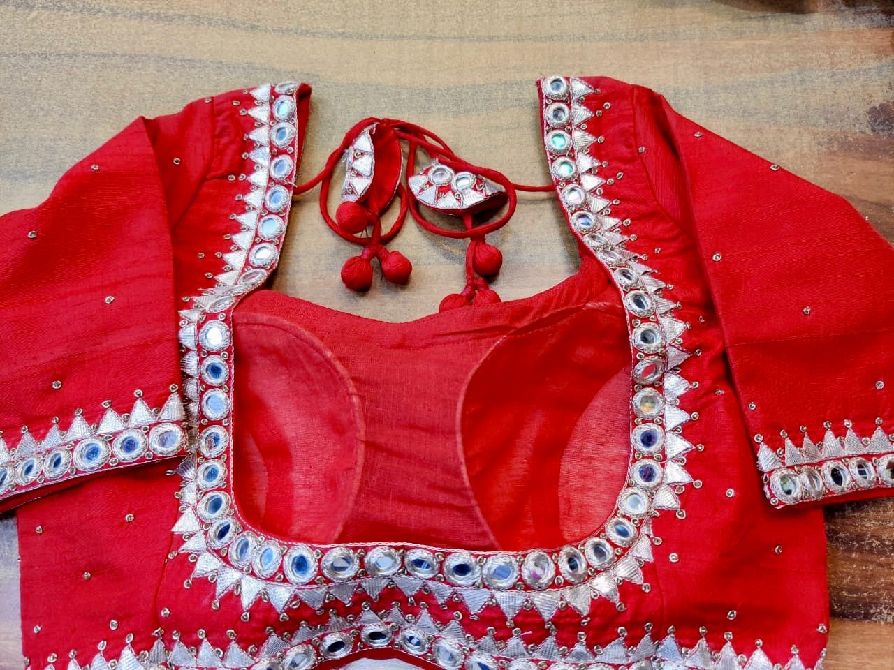 Buy beautiful red mirror embroidery designer sari blouse online in USA. Elevate your ethnic saree style with a tasteful collection of designer saree blouses, embroidered sari blouses, Banarasi blouses, silk saree blouses from Pure Elegance Indian clothing store in USA.-back