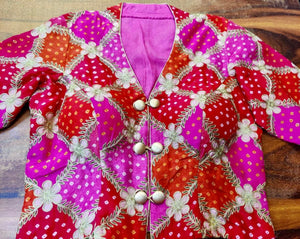 Shop pink and red embroidered silk bandhej silk saree blouse online in USA. Elevate your ethnic saree style with a tasteful collection of designer saree blouses, embroidered sari blouses, Banarasi blouses, silk saree blouses from Pure Elegance Indian clothing store in USA.-front