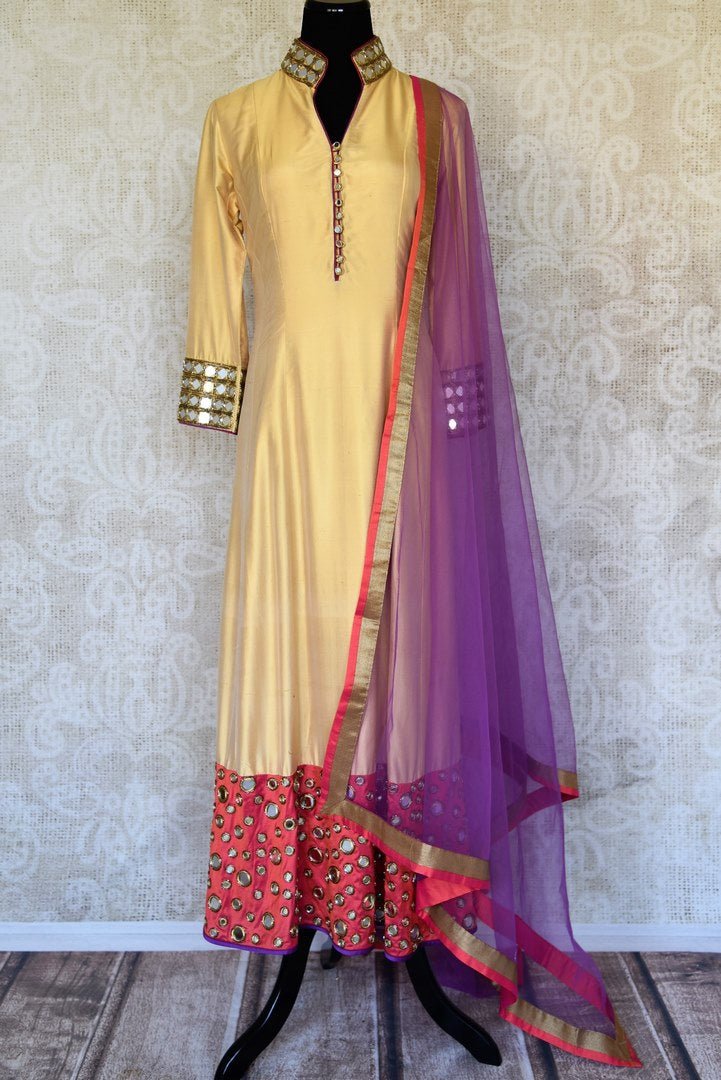 Buy beige and red silk suit online in USA with purple dupatta and mirror work from Pure Elegance. Choose from a range of exclusive Indian designer suits, wedding dresses, Anarkali suits in beautiful styles and designs from our Indian fashion store in USA and flaunt your tasteful sartorial choices on special occasions.-full view
