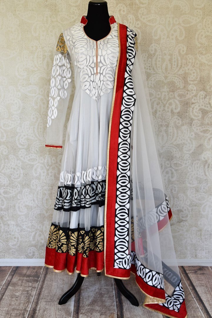 Buy white embroidered net Anarkali suit online in USA with red and black border from Pure Elegance. Choose from a range of exclusive Indian designer suits, wedding dresses, Anarkali suits in beautiful styles and designs from our Indian fashion store in USA and flaunt your tasteful sartorial choices on special occasions.-full view