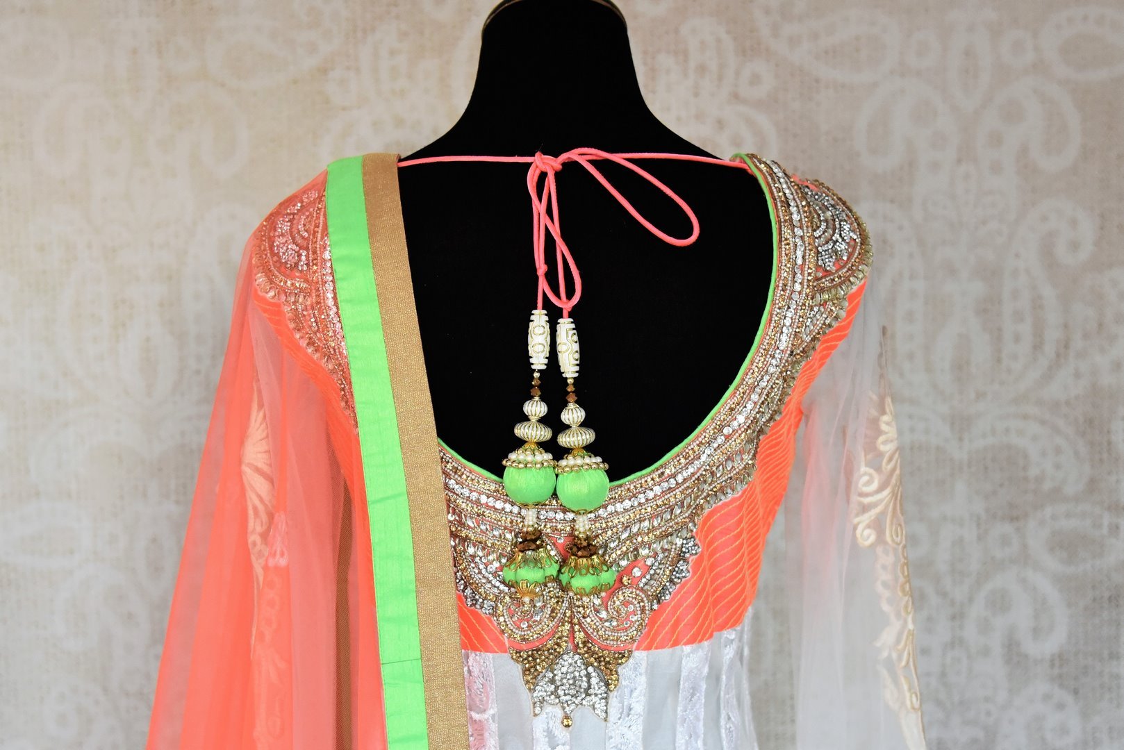Buy white embroidered net floor length Anarkali suit online in USA with orange and green border from Pure Elegance. Choose from a range of exclusive Indian designer suits, wedding dresses, Anarkali suits in beautiful styles and designs from our Indian fashion store in USA and flaunt your tasteful sartorial choices on special occasions.-back
