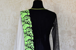 Shop black and white embroidered net floor length Anarkali suit online in USA with green border from Pure Elegance. Choose from a range of exclusive Indian designer suits, wedding dresses, Anarkali suits in beautiful styles and designs from our Indian fashion store in USA and flaunt your tasteful sartorial choices on special occasions.-back