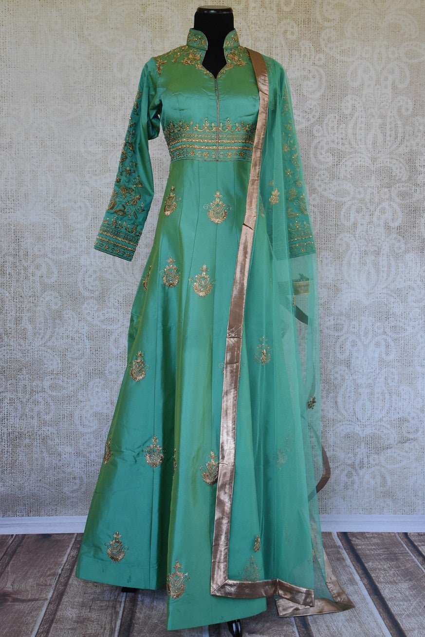 Green solid Suit with gold zari embroidery. Perfect suit for Indian parties and festivals.-full view