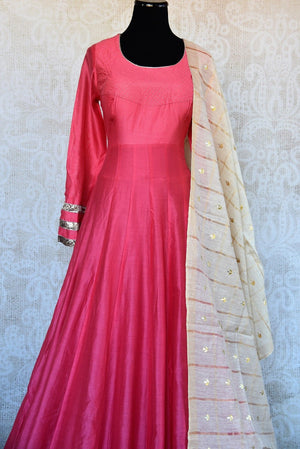 Pink two piece floor length solid chanderi anarkali suit with dupatta in gown style available at Pure Elegance. Perfect for all Indian events and evening parties-close up