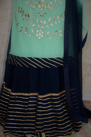 Georgette leather work mint green straight kurta with blue gotta patti work on lahnga skirt and shaded dupatta available at Pure Elegance online and in store-Navy Skirt with gotta patti work