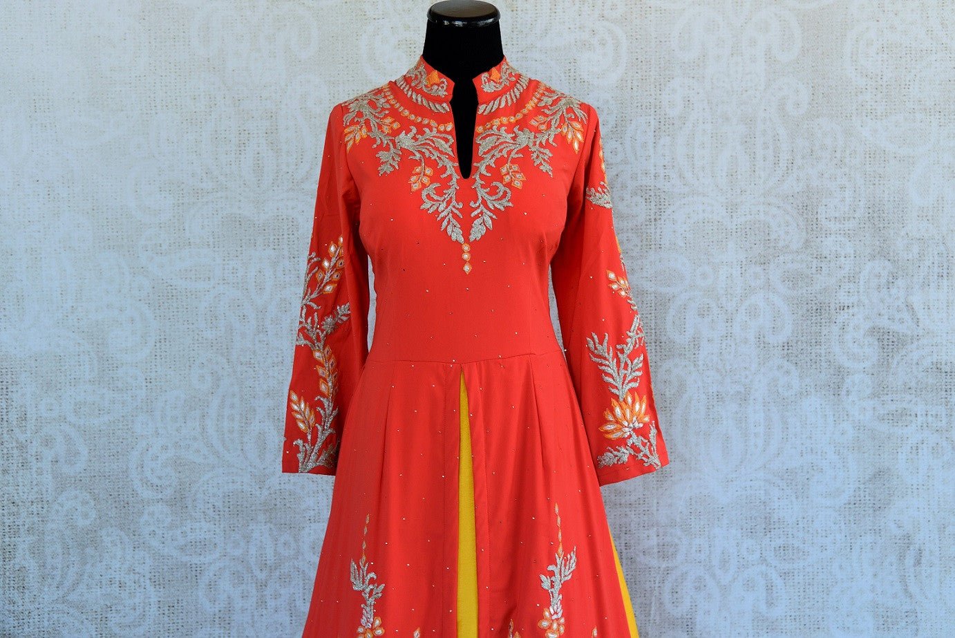 Designer silk embroidered suit with skirt set in orange and yellow color available in size38 at Pure Elegance and online.This pious combination is great for all- top part of suit