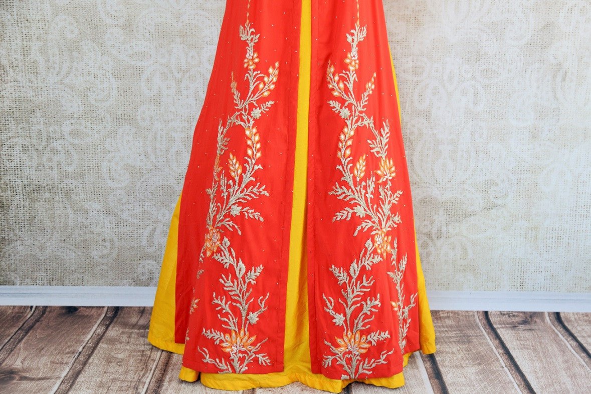Designer silk embroidered suit with skirt set in orange and yellow color available in size38 at Pure Elegance and online.This pious combination is great for all-lower half of suit