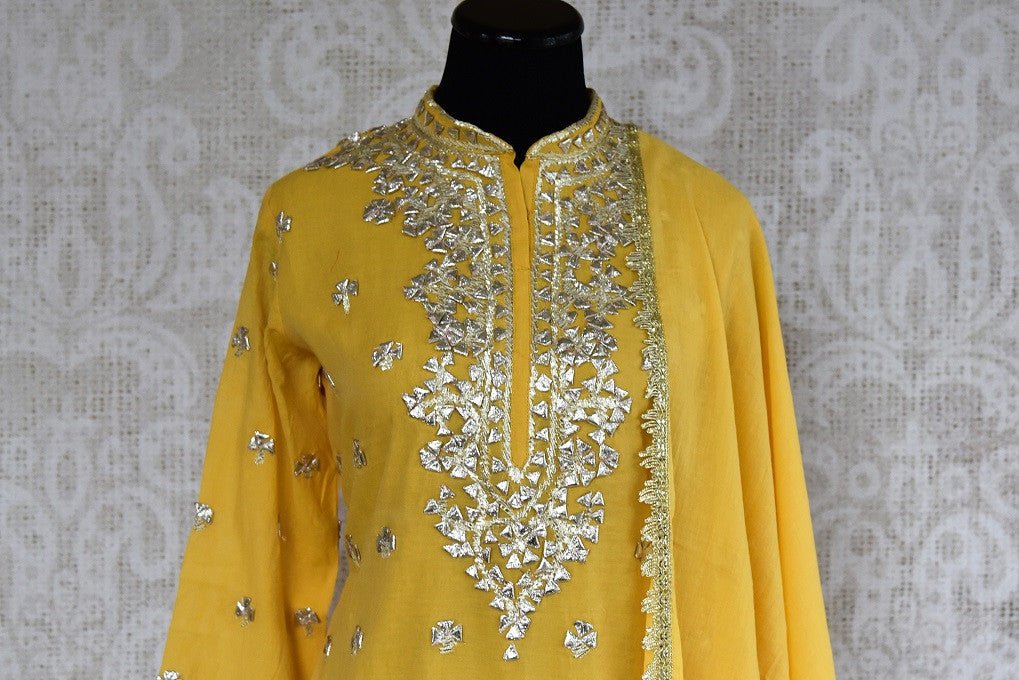  Buy this eye catching yellow silk sharara indian suit and dupatta with gotta patti designs from pure elegance online. Great for parties and festive occasions-Suit Top & Embroidery