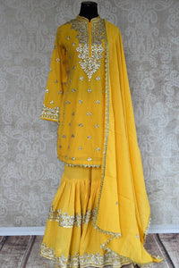 Buy this eye catching yellow silk sharara indian suit and dupatta with gotta patti designs from pure elegance online. Great for parties and festive occasions.-Full View