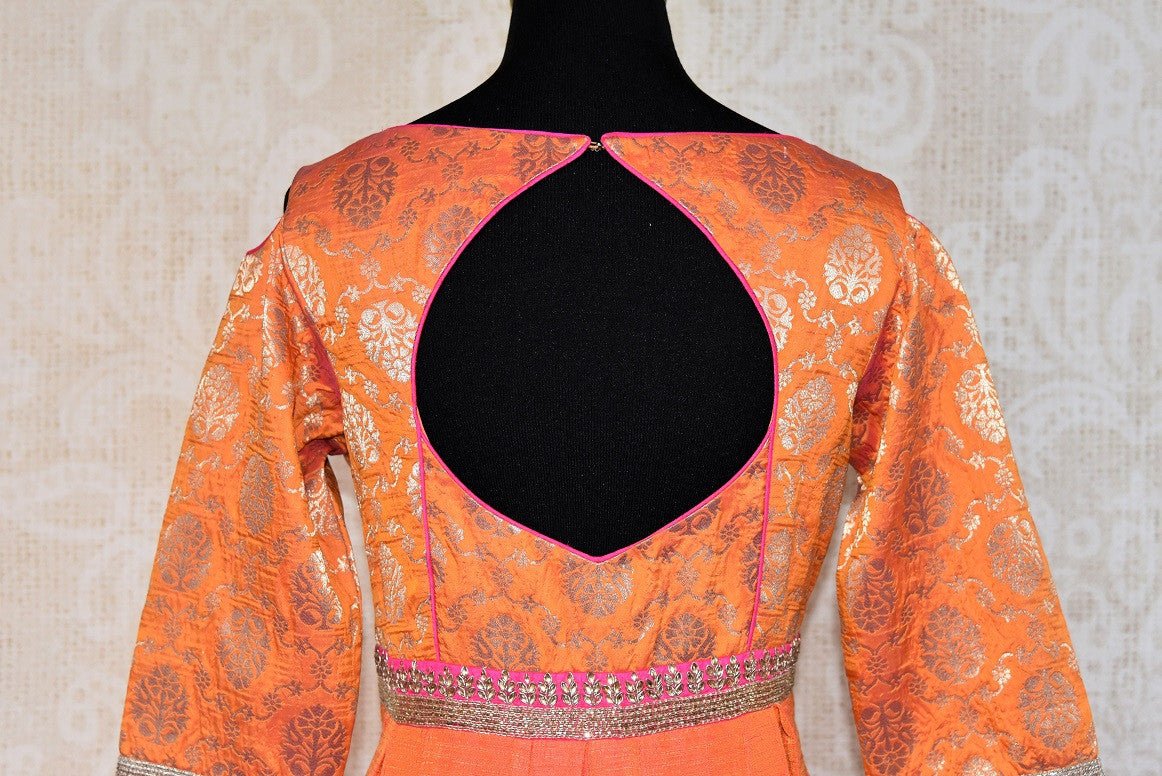 Buy this elegant and eye catching orange banarasi raw silk floor length indian suit with dupatta from pure elegance store. Great for parties and festive occasions-Back View