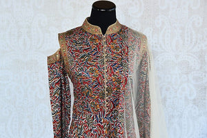 Designer zari Embroidered cold shoulder kalamkari print suit with net dupatta. Grab Graceful Indian party outfit.-cold shoulder detailings