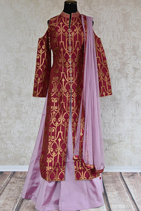 Buy Purple banarasi suit with solid palazzo with abundance of hem. This party suit has front slit and cold shoulder design.-Full view