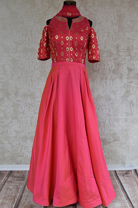 Buy pink anarkali suit with banarasi brocade bodice and solid skirt which has pleats both sides. Suit has cold shoulder and embroidered neck line and net scarf.-full view