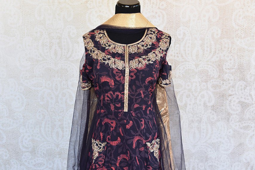 Modern and classy cold shoulder black and pink printed floor length anarkali with gold embroidery and net dupatta-top view