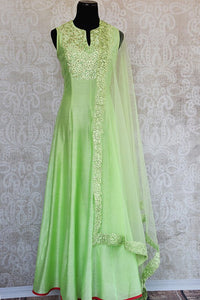 Green thread-work embroidered anarkali suit with net dupatta. Perfect party wear suit for Indian events. -Full View