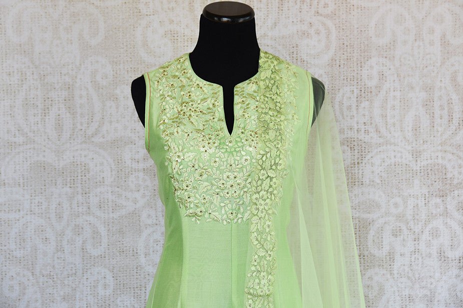 Green thread-work embroidered anarkali suit with net dupatta. Perfect party wear suit for Indian events. - embroidery close up