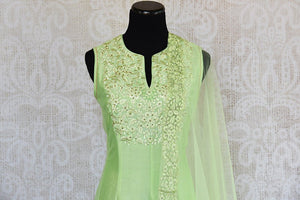 Green thread-work embroidered anarkali suit with net dupatta. Perfect party wear suit for Indian events. - embroidery close up
