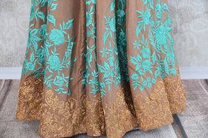 Brown chanderi anarkali suit with turquoise thread embroidery available at Indian women clothing store pure elegance in USA. Perfect party suit for weddings -embroidery close up